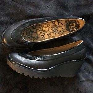 Black leather wedge shoes